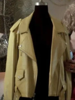 Front view of a yellow leather motorcycle jacket on a mannequin, featuring wide lapels, silver snaps, and an asymmetrical zipper, capturing the 90s Buffy style.