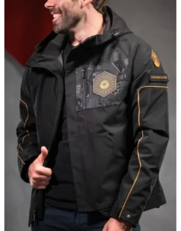 Man smiling while wearing the black and gold Destiny 2 Salvation's Edge Jacket. Details of the front design are visible. Final Shape Raid Jacket.