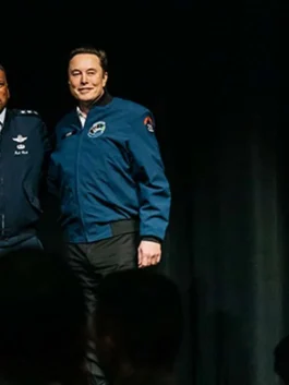 elon musk usafa jacket in a classic navy blue with official-style academy patches.