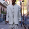 Lewis Hamilton Monaco Grand Prix suit in an off-white shade, styled with a formal waistcoat and baggy trousers for a modern 3 piece suit aesthetic.