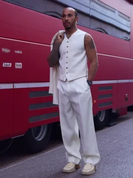 Lewis Hamilton white waistcoat suit styled without a jacket to reveal a sleek vest and wide-leg pants during the Monaco GP paddock walk.
