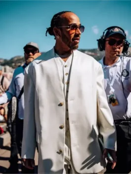 Lewis Hamilton three piece white suit worn at the Monaco Grand Prix, featuring a relaxed-fit blazer and matching vest for a high-fashion look.