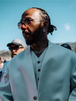 Close-up of the Lewis Hamilton white three piece suit with luxury sunglasses and jewelry, highlighting his unique Monaco outfit suit details.