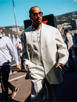 Monaco Lewis Hamilton white suit look featuring an oversized jacket and tailored trousers, showcasing his signature paddock style and luxury fashion.