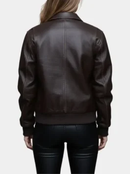 Back view of the Sydney Sweeney The Housemaid jacket, a premium dark brown leather bomber with detailed stitching and a ribbed waist for Millie.