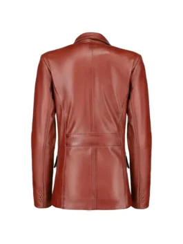 Back view of tan leather blazer showing center seam, shaped panels, and buttoned cuffs