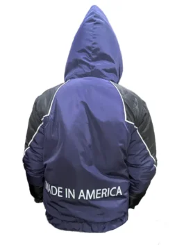 A professional product shot of the Nikki Glaser Marty Supreme 2026 jacket in black and blue, featuring a relaxed fit.