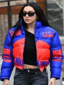 Front view of Charli XCX wearing a black hooded cropped jacket at Sundance 2026 by America Jackets.