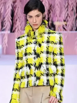 Gracie Abrams wearing a stylish Spring 2026 couture yellow jacket by America Jackets, front view.