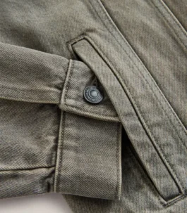 Detailed shot of the adjustable cuff and side welt pocket on a Women Grey Denim Jacket, showcasing the authentic texture of the Grey jeans jacket.