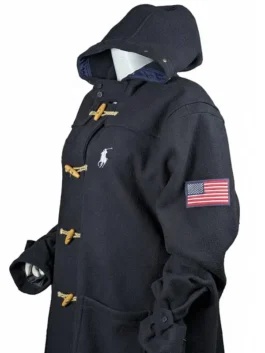 Navy blue Olympic ceremony coat with white polo pony embroidery and a red-lined interior hood detail.