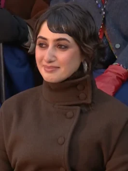 Rama Duwaji 2026 Coat close-up showing high stand collar and asymmetrical covered buttons in brown