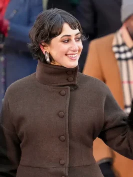 Rama Duwaji 2026 Coat mid view with structured high neck and clean button front in rich brown