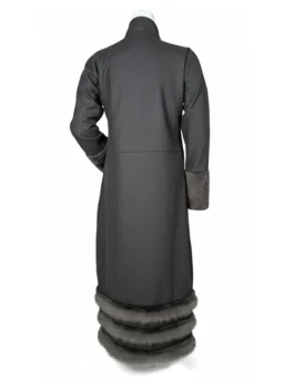 A detailed side view of a women's long brown coat featuring a high buttoned collar and faux fur detailing.