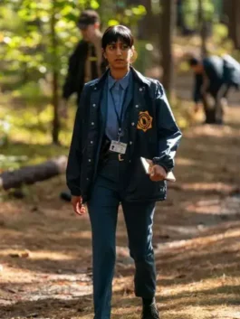 Sunita Mani wearing a bright blue jacket from His and Hers at America Jackets.