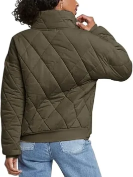 Back view of a Women's Army Green Dolman Quilted Jacket on a model, highlighting the relaxed dolman quilted knit jacket fit and ribbed hem.