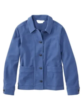 A woman wearing a blue stretch barn jacket by America Jackets, front view showing the collar and pockets.