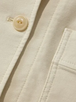 Close-up shot of the blue fabric and collar on the Women's Bean's Stretch Barn Jacket by America Jackets.