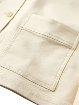 Detail shot of the pocket and button closure on the blue Women's Bean's Stretch Barn Jacket at America Jackets.