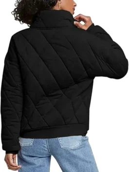 Rear view of a model wearing the dolman quilted knit jacket Black, highlighting the relaxed fit, dropped shoulders, and stylish oversized silhouette.