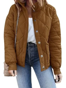 A stylish Dolman Quilted Jacket in brown styled with jeans, featuring a full button-down front and oversized sleeves for a modern look.