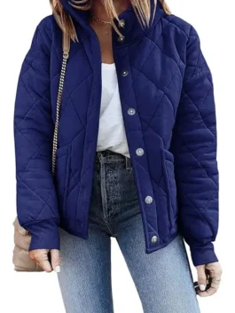A stylish Womens Navy Dolman Quilted Jacket styled with jeans, highlighting the front button closure, side pockets, and relaxed dolman sleeve fit.