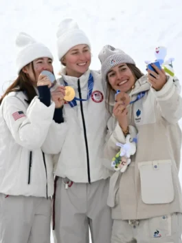 Medallists including Elizabeth Lemley Quilted Puffer Jacket 2026 Wintet Olympics winner take a selfie in their official team Nike gear.