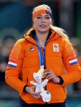 Jutta Leerdam Team NL jacket and gold medal at the Winter Olympics 2026 Netherlands puffer jacket ceremony while holding the mascot.