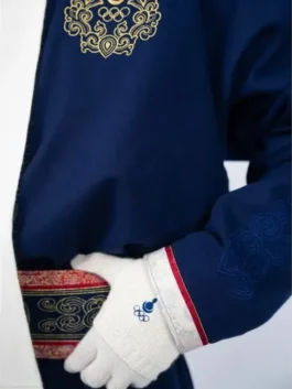 Close-up of the Mongolia Olympics 2026 opening ceremony outfit for men, showing the gold embroidered crest and white gloves with Olympic branding.