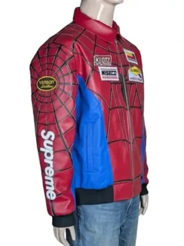 Profile view of a red leather racing jacket with blue sleeve accents and collaborative sleeve branding.