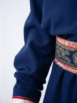 Side profile of the Team Mongolia deel robe outfit for men, displaying the structured fit and traditional craftsmanship of the 2026 parade uniform.
