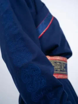 Detail of the sleeve on the Winter Olympics 2026 mens Mongolia deel, featuring subtle tonal embroidery on a high-quality cashmere silk deel outfit.