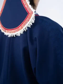 Close-up of Winter Olympics 2026 Team Mongolia uniform mens deel featuring a high collar, intricate embroidery, and traditional ceremonial robe details.