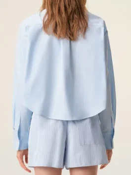 Anne Hathaway The Devil Wears Prada 2 Blue Shirt back view showing the seamless tailoring and elegant garment flow.