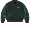 Supreme Cross Varsity Jacket featuring a professional front view with a sturdy snap closure and premium ribbing.