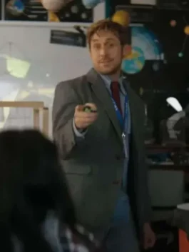 Ryan Gosling as Ryland Grace wearing a Project Hail Mary grey wool blazer in a science classroom.