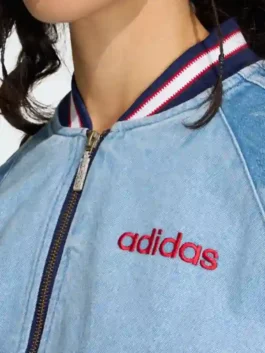 Adidas Denim Graphic Varsity Bomber Jacket closeup featuring professional rib knit collar and luxury zipper.