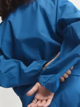 Adidas Babymonster Jacket showcasing professional blue panels and luxury adaptive cuffs.