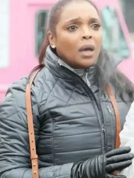 Chicago Med Maggie Lockwood Black Puffer Jacket showcasing professional open hem cuffs and a luxury black drape.