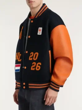 Denham Team NL Varsity Jacket in a professional black finish with a sturdy tailored build and luxury orange accents.