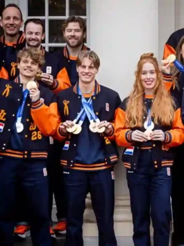 Denham Team NL Varsity Jacket in professional black and orange wool with luxury leather sleeves and rib knitted cuffs.