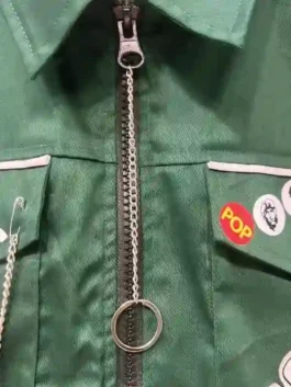 The Mighty Boosh Vince Noir Jacket closeup view highlighting professional green fabric and luxury zipper style.