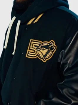 Toronto Blue Jays Anniversary Varsity Jacket featuring professional wool panels and a luxury front button closure.