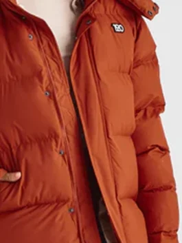 1920 Orange Puffer Jacket from the Shark Tank brand in striking orange with a removable hood, snap tab buttons and a sharp parachute puffer design.
