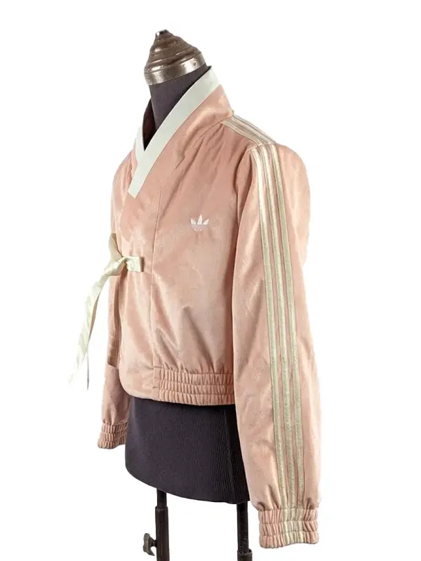 Lightweight athletic fusion jacket with full-length sleeves and a soft-touch fabric finish.