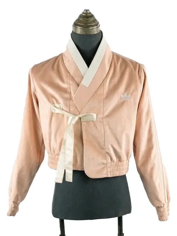 Front view of a K-pop inspired fusion jacket with a minimalist body and decorative sleeves.