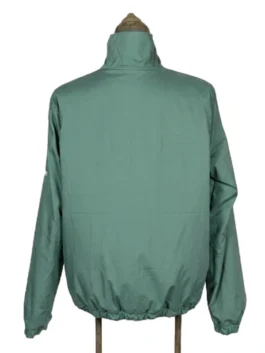 Rear view of the solid Masters green nylon side of the reversible golf windbreaker jacket on a studio dress form.