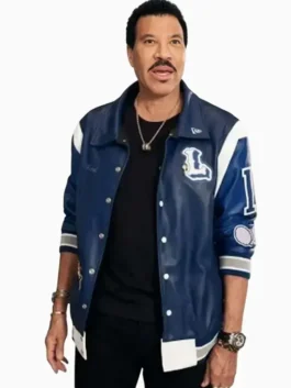 American Idol Lionel Richie Blue Varsity Jacket in striking blue leather with rib knitted cuffs, snap tab closure and a sharp varsity build.