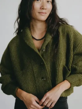 Beef Carey Mulligan Cardigan front view in warm olive knitted fabric with a shawl lapel collar and a relaxed refined button-up silhouette.