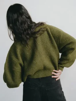 Beef Carey Mulligan Cardigan back view in soft olive knitted fabric with a clean relaxed silhouette and open hem cuffs.